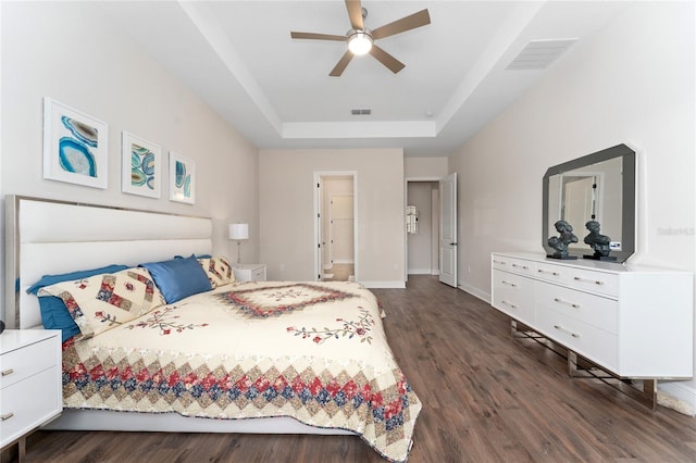 1598 Whitewood Ct, Kissimmee, FL 34747 - bedroom with a raised ceiling, dark wood-type flooring, baseboards, and a ceiling fan