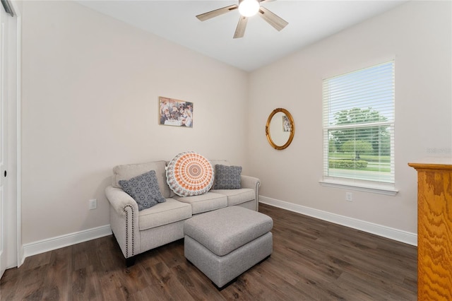 1598 Whitewood Ct, Kissimmee, FL 34747 - living area featuring a ceiling fan, dark wood-type flooring, and baseboards
