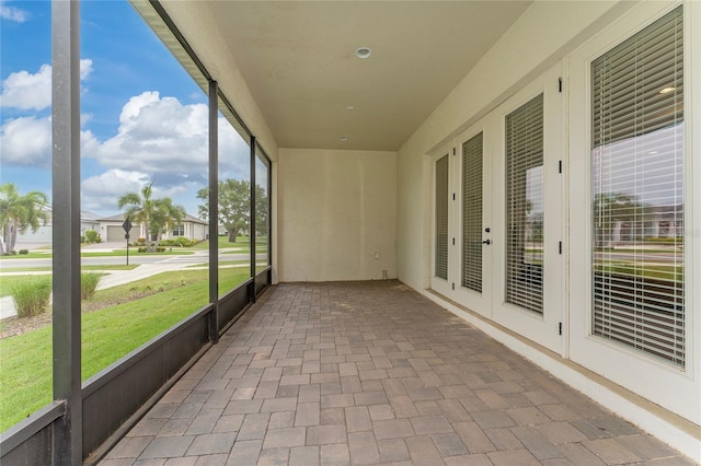1598 Whitewood Ct, Kissimmee, FL 34747 - unfurnished sunroom featuring french doors