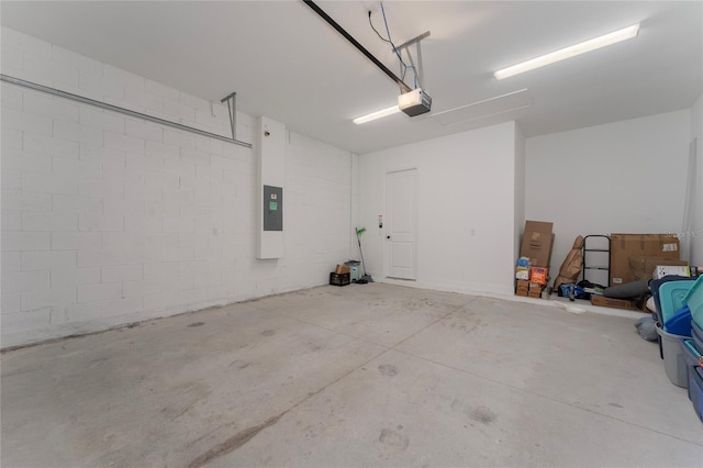 1598 Whitewood Ct, Kissimmee, FL 34747 - garage with a garage door opener, electric panel, and concrete block wall