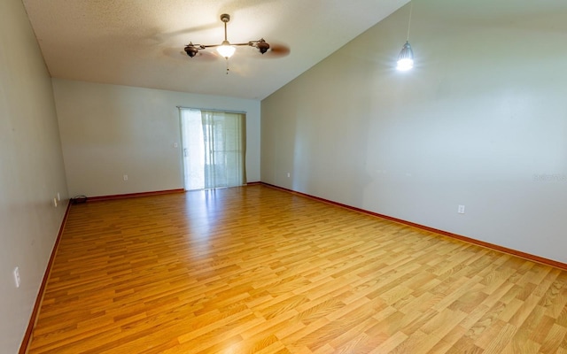 3267 Villa Way Cir, Saint Cloud, FL 34769 - spare room with light wood finished floors, vaulted ceiling, and ceiling fan