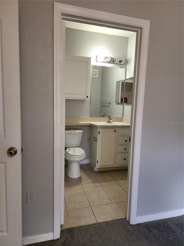 1325 Lake Shadow Cir Unit 12205, Maitland, FL 32751 - bathroom featuring vanity, tile patterned flooring, toilet, baseboards, and a textured wall