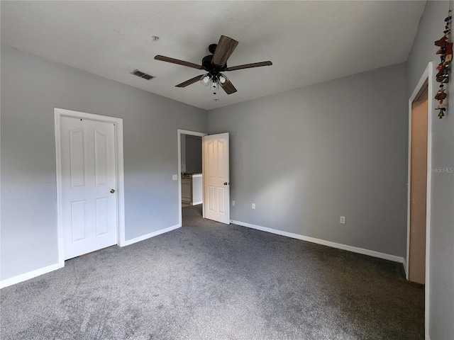 1325 Lake Shadow Cir Unit 12205, Maitland, FL 32751 - unfurnished bedroom with dark carpet, baseboards, and ceiling fan