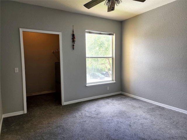 1325 Lake Shadow Cir Unit 12205, Maitland, FL 32751 - empty room featuring a ceiling fan, carpet flooring, healthy amount of natural light, a textured wall, and baseboards