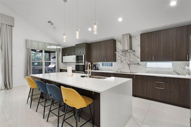 2561 Montego Bay Blvd, Kissimmee, FL 34746 - kitchen featuring wall chimney range hood, a sink, stainless steel appliances, light countertops, and decorative backsplash