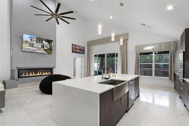2561 Montego Bay Blvd, Kissimmee, FL 34746 - kitchen featuring dishwasher, modern cabinets, open floor plan, a glass covered fireplace, and ceiling fan