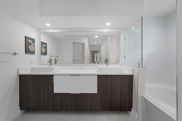 2561 Montego Bay Blvd, Kissimmee, FL 34746 - full bath with double vanity, a tub, recessed lighting, and a shower