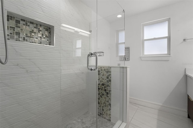 2561 Montego Bay Blvd, Kissimmee, FL 34746 - bathroom with vanity, a shower stall, and baseboards