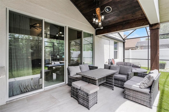 2561 Montego Bay Blvd, Kissimmee, FL 34746 - view of patio / terrace with an outdoor living space and glass enclosure