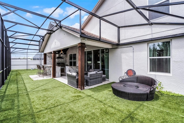 2561 Montego Bay Blvd, Kissimmee, FL 34746 - back of house with a yard, stucco siding, outdoor lounge area, a patio area, and glass enclosure