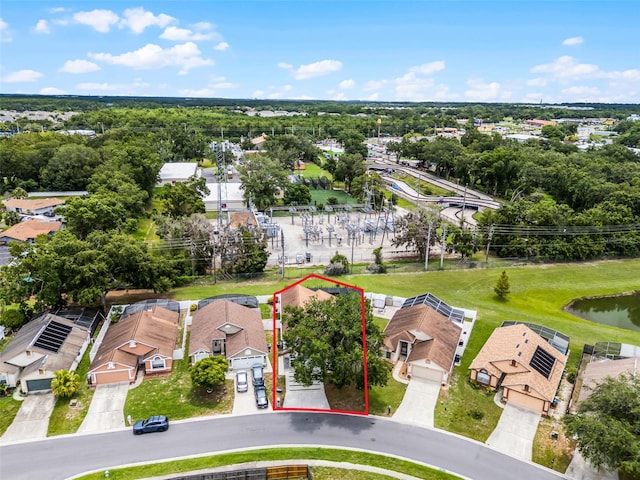 2561 Montego Bay Blvd, Kissimmee, FL 34746 - aerial perspective of suburban area featuring property boundaries highlighted and a nearby body of water