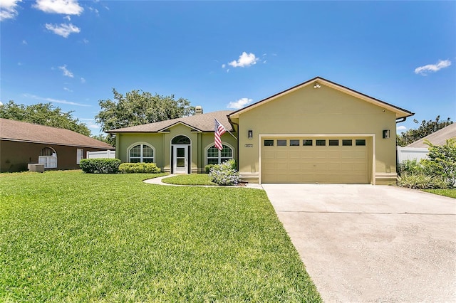1822 Ashton Dr E, Saint Cloud, FL 34771 - ranch-style house with a front lawn, an attached garage, driveway, and stucco siding
