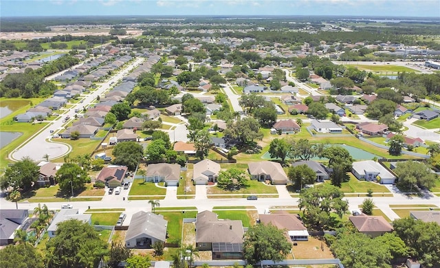 1822 Ashton Dr E, Saint Cloud, FL 34771 - aerial perspective of suburban area with a nearby body of water