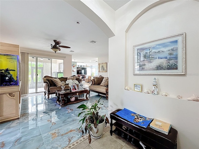 16072 Shasta St, Clermont, FL 34714 - living area with healthy amount of natural light, arched walkways, and ceiling fan