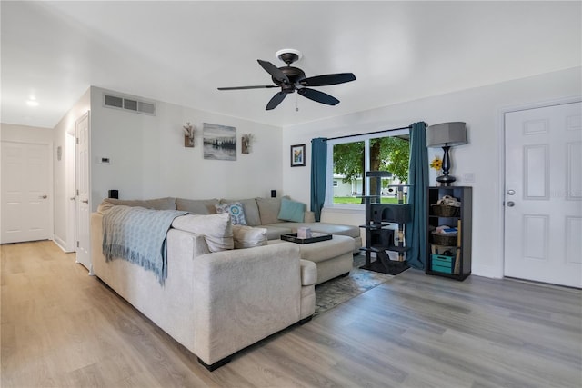 2 S Lavon Ave, Kissimmee, FL 34741 - living area featuring ceiling fan, light wood finished floors, and baseboards