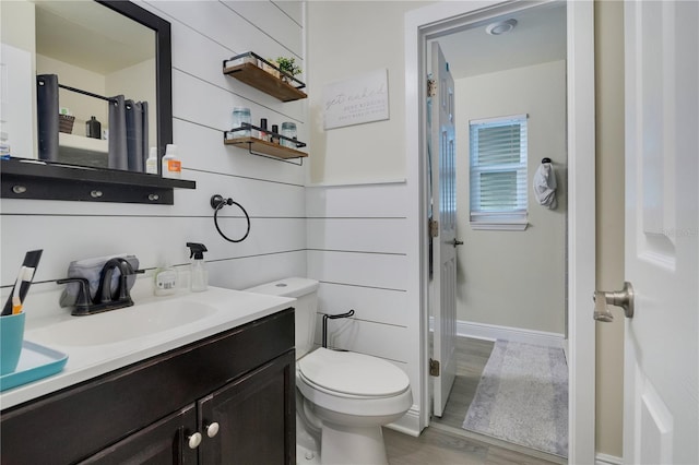 2 S Lavon Ave, Kissimmee, FL 34741 - bathroom featuring toilet, baseboards, vanity, wood finished floors, and a shower with curtain