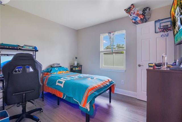 2 S Lavon Ave, Kissimmee, FL 34741 - bedroom featuring wood finished floors and baseboards