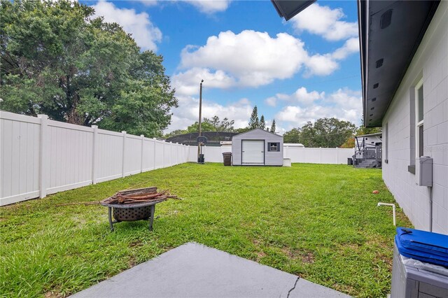 2 S Lavon Ave, Kissimmee, FL 34741 - view of yard with an outdoor fire pit