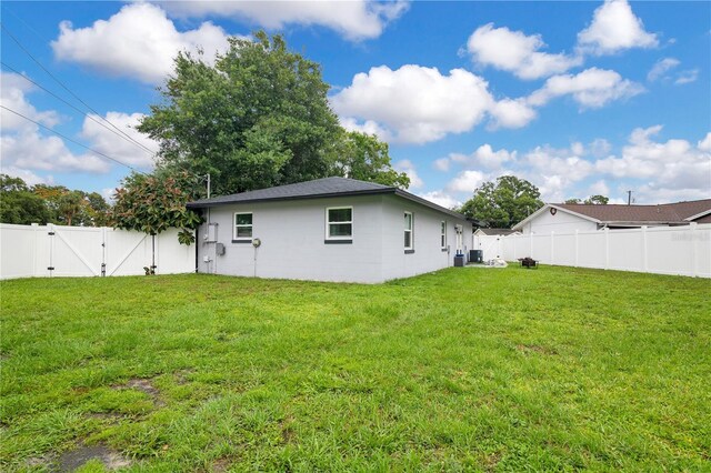 2 S Lavon Ave, Kissimmee, FL 34741 - rear view of property with a gate