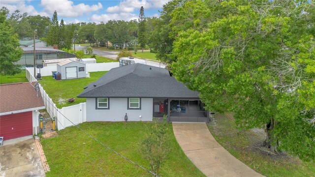 2 S Lavon Ave, Kissimmee, FL 34741 - view of front facade with a gate, roof with shingles, stucco siding, and concrete driveway