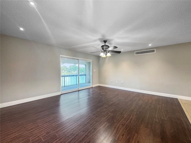 626 Orange Dr Unit 243, Altamonte Springs, FL 32701 - unfurnished room with dark wood-style flooring, ceiling fan, a textured ceiling, baseboards, and recessed lighting