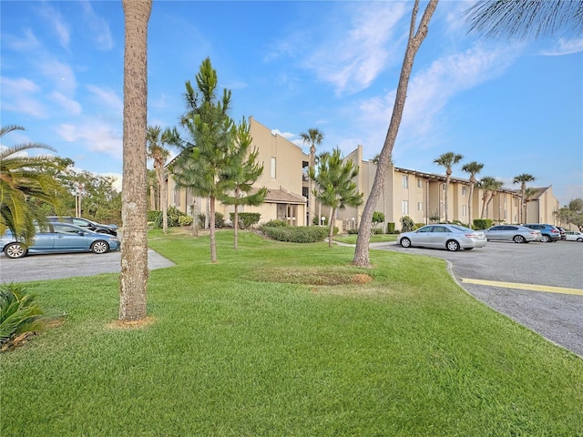 626 Orange Dr Unit 243, Altamonte Springs, FL 32701 - view of building exterior featuring uncovered parking and a residential view