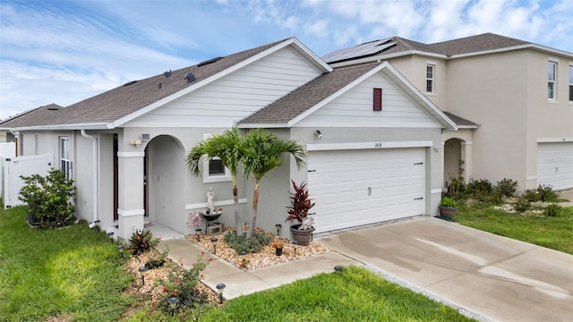 2838 Common Crane Ct, Harmony, FL 34773 - traditional-style home featuring driveway, a shingled roof, stucco siding, and a garage