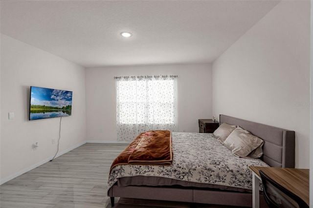 2838 Common Crane Ct, Harmony, FL 34773 - bedroom featuring light wood-type flooring, baseboards, and recessed lighting