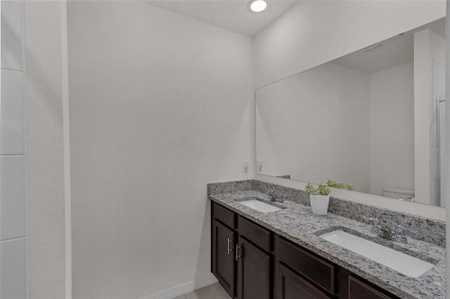 2838 Common Crane Ct, Harmony, FL 34773 - full bathroom featuring double vanity, toilet, and baseboards