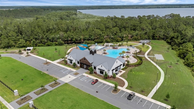 2838 Common Crane Ct, Harmony, FL 34773 - drone / aerial view of a heavily wooded area, a nearby body of water, and a pool