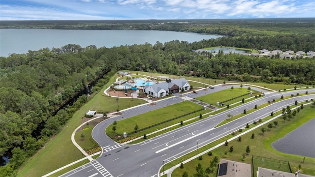 2838 Common Crane Ct, Harmony, FL 34773 - aerial view of a forest, a pool, and a nearby body of water