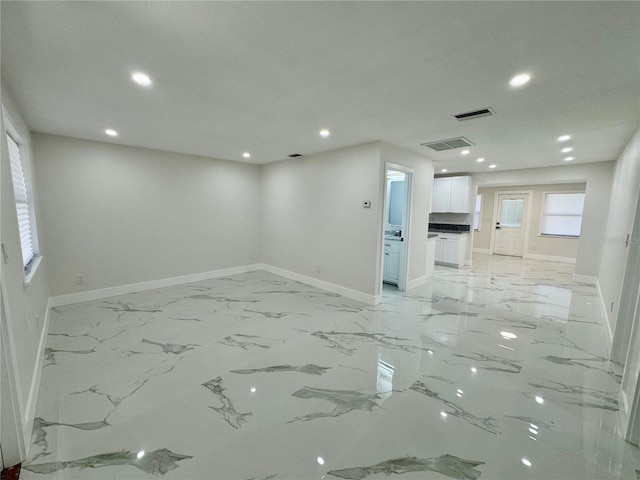 390 Hazel Cir, Punta Gorda, FL 33982 - spare room featuring baseboards, recessed lighting, and light marble finish flooring