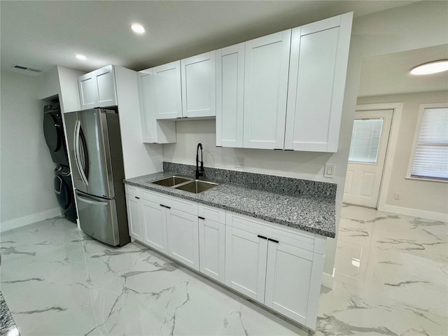 390 Hazel Cir, Punta Gorda, FL 33982 - kitchen with a sink, freestanding refrigerator, light marble finish floors, baseboards, and recessed lighting