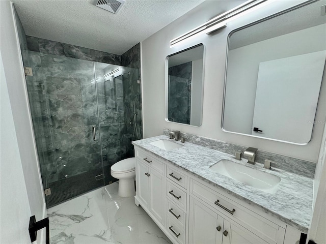 390 Hazel Cir, Punta Gorda, FL 33982 - bathroom featuring a marble finish shower, double vanity, marble look tiles, toilet, and a textured ceiling