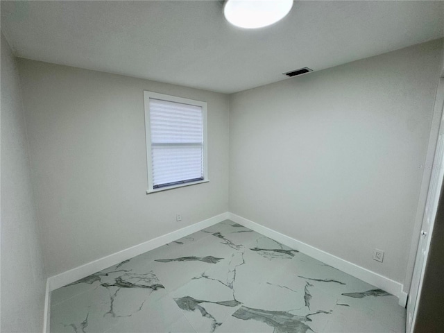 390 Hazel Cir, Punta Gorda, FL 33982 - unfurnished room with baseboards and marble look tile flooring