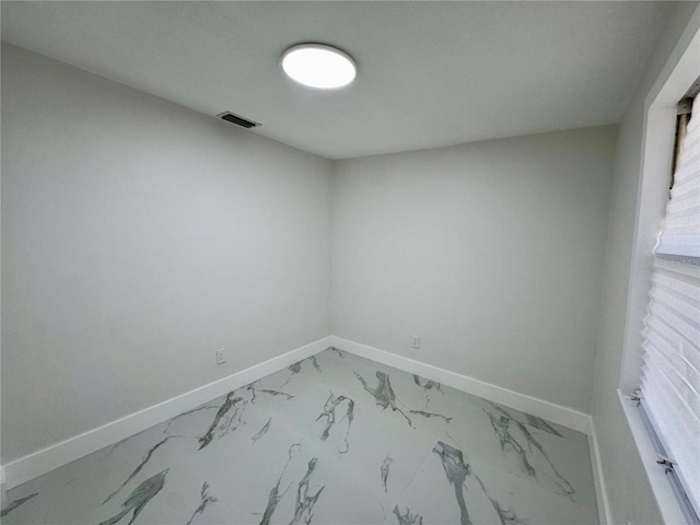390 Hazel Cir, Punta Gorda, FL 33982 - spare room with baseboards and light marble finish flooring
