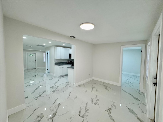 390 Hazel Cir, Punta Gorda, FL 33982 - spare room featuring recessed lighting, baseboards, and light marble finish flooring