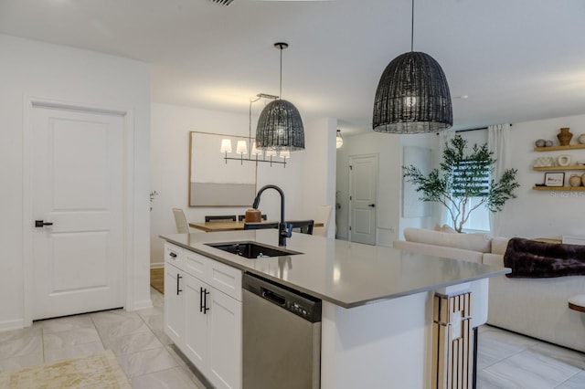466 Cool Summer Ln, Davenport, FL 33837 - kitchen with stainless steel dishwasher, a sink, a chandelier, open floor plan, and white cabinets
