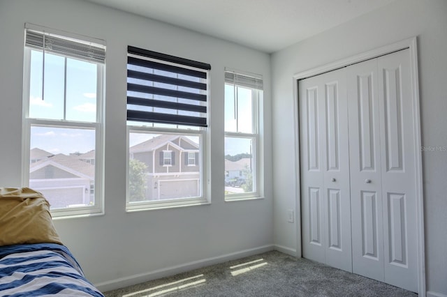 466 Cool Summer Ln, Davenport, FL 33837 - carpeted bedroom featuring a closet and baseboards