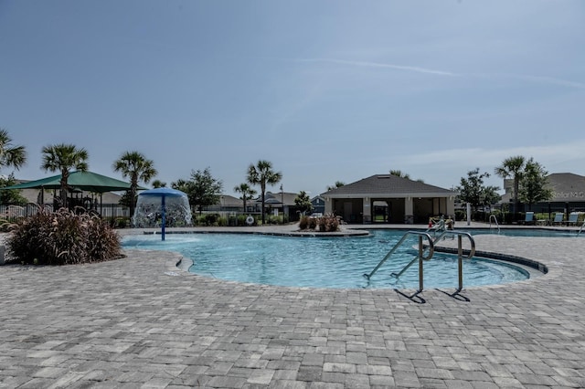 466 Cool Summer Ln, Davenport, FL 33837 - community pool featuring a patio area
