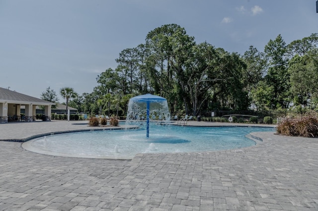 466 Cool Summer Ln, Davenport, FL 33837 - community pool featuring a patio area