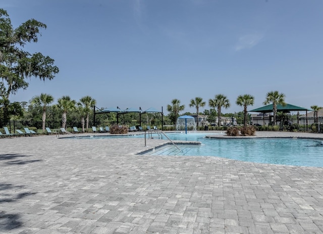 466 Cool Summer Ln, Davenport, FL 33837 - community pool with a patio