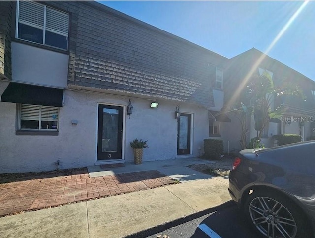 1920 Conway Rd Unit 4, Orlando, FL 32812 - view of front of property with stucco siding and roof with shingles