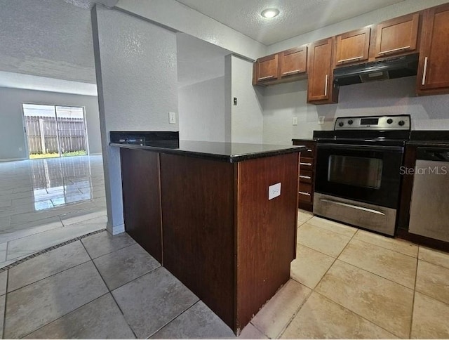 1920 Conway Rd Unit 4, Orlando, FL 32812 - kitchen featuring stainless steel appliances, under cabinet range hood, a textured ceiling, a peninsula, and light tile patterned floors