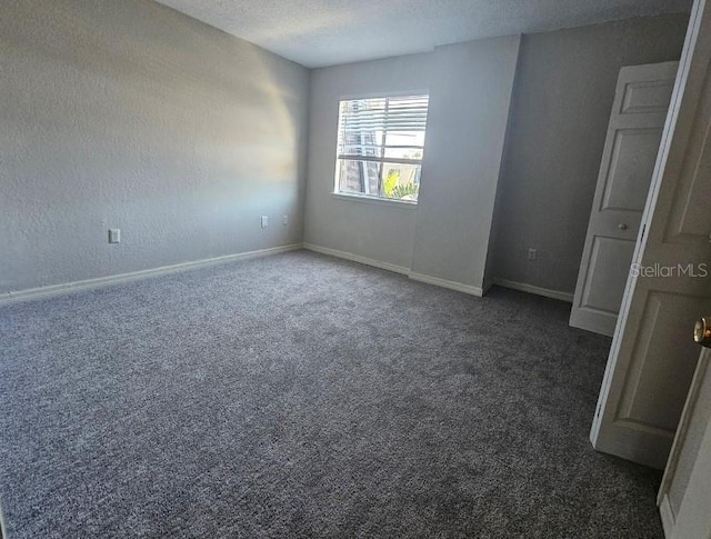 1920 Conway Rd Unit 4, Orlando, FL 32812 - carpeted empty room with baseboards and a textured ceiling