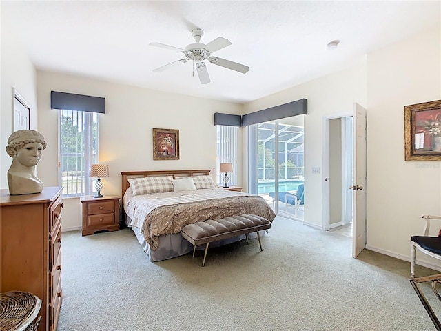 116 Westport Ln, Davenport, FL 33896 - bedroom with access to outside, light carpet, a ceiling fan, and baseboards