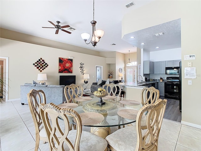 116 Westport Ln, Davenport, FL 33896 - dining room featuring light tile patterned floors, ceiling fan, and baseboards