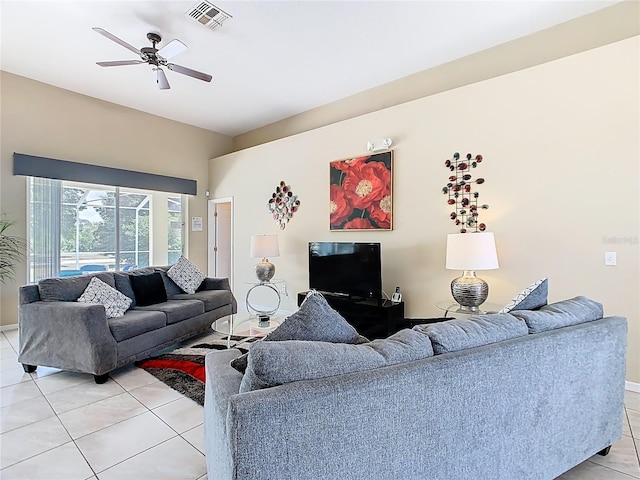 116 Westport Ln, Davenport, FL 33896 - living room with light tile patterned floors, ceiling fan, and baseboards