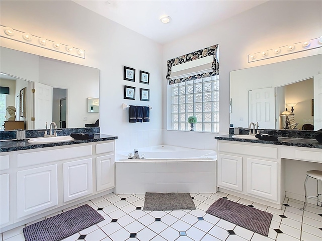 116 Westport Ln, Davenport, FL 33896 - full bathroom featuring healthy amount of natural light, a bath, and two vanities