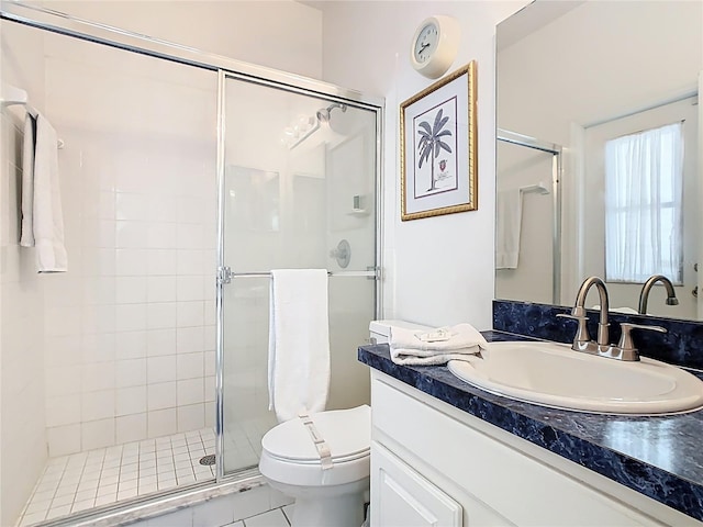 116 Westport Ln, Davenport, FL 33896 - full bath featuring toilet, a shower stall, vanity, and tile patterned floors